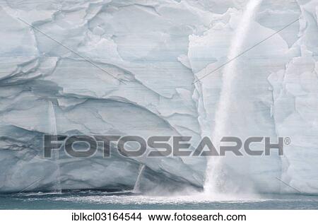 Picture - "Meltwater waterfalls at the glacier front of Brasvellbreen, the longest glacier front in the northern hemisphere, Austfonna, Nordaustlandet, Svalbard Archipelago, Svalbard and Jan Mayen, Norway, Europe". Fotosearch