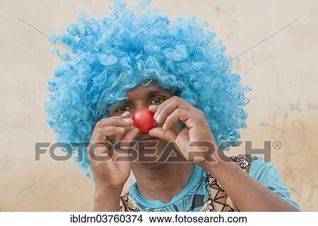 Picture - "Member of a carnival club in the slums of Ribeira Bote, Praia, Santiago Island, Cape Verde, Africa". Fotosearch