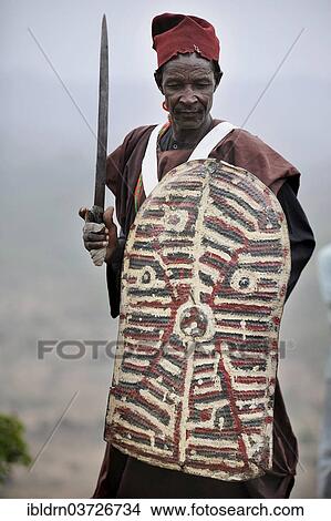 "Member of a folklore group, presentation of traditional music and dance, Rhumsiki, Far North, Cameroon, Africa" View Large Photo Image Picture - "Member of a folklore group, presentation of traditional music and dance, Rhumsiki, Far North, Cameroon, Africa". Fotosearch