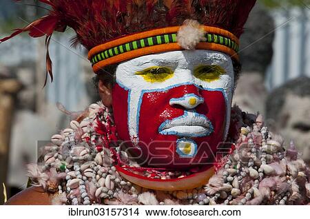 "Member of a tribe in a colourfully decorated costume with face paint at the traditional sing-sing gathering, Hochland, Mount Hagen, Western Highlands Province, Papua New Guinea, Oceania" View Large Photo Image Picture - "Member of a tribe in a colourfully decorated costume with face paint at the traditional sing-sing gathering, Hochland, Mount Hagen, Western Highlands Province, Papua New Guinea, Oceania". Fotosearch