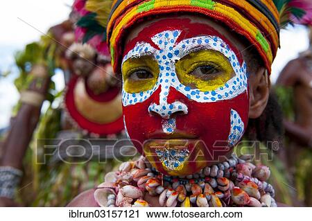 "Member of a tribe in a colourfully decorated costume with face paint at the traditional sing-sing gathering, Hochland, Mount Hagen, Western Highlands Province, Papua New Guinea, Oceania" View Large Photo Image Stock Image - "Member of a tribe in a colourfully decorated costume with face paint at the traditional sing-sing gathering, Hochland, Mount Hagen, Western Highlands Province, Papua New Guinea, Oceania". Fotosearch