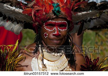 "Member of a tribe in a colourfully decorated costume with face paint at the traditional sing-sing gathering, Hochland, Mount Hagen, Western Highlands Province, Papua New Guinea, Oceania" View Large Photo Image Stock Image - "Member of a tribe in a colourfully decorated costume with face paint at the traditional sing-sing gathering, Hochland, Mount Hagen, Western Highlands Province, Papua New Guinea, Oceania". Fotosearch