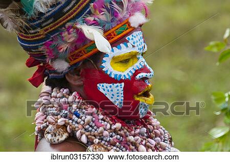 "Member of a tribe in a colourfully decorated costume with face paint at the traditional sing-sing gathering, Hochland, Mount Hagen, Western Highlands Province, Papua New Guinea, Oceania" View Large Photo Image Stock Image - "Member of a tribe in a colourfully decorated costume with face paint at the traditional sing-sing gathering, Hochland, Mount Hagen, Western Highlands Province, Papua New Guinea, Oceania". Fotosearch