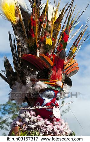 "Member of a tribe in a colourfully decorated costume with face paint at the traditional sing-sing gathering, Hochland, Mount Hagen, Western Highlands Province, Papua New Guinea, Oceania" View Large Photo Image Stock Photo - "Member of a tribe in a colourfully decorated costume with face paint at the traditional sing-sing gathering, Hochland, Mount Hagen, Western Highlands Province, Papua New Guinea, Oceania". Fotosearch