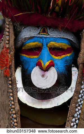 "Member of a tribe in a colourfully decorated costume with face paint at the traditional sing-sing gathering, Hochland, Mount Hagen, Western Highlands Province, Papua New Guinea, Oceania" View Large Photo Image Stock Photo - "Member of a tribe in a colourfully decorated costume with face paint at the traditional sing-sing gathering, Hochland, Mount Hagen, Western Highlands Province, Papua New Guinea, Oceania". Fotosearch