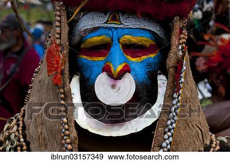 "Member of a tribe in a colourfully decorated costume with face paint at the traditional sing-sing gathering, Hochland, Mount Hagen, Western Highlands Province, Papua New Guinea, Oceania" View Large Photo Image Stock Photo - "Member of a tribe in a colourfully decorated costume with face paint at the traditional sing-sing gathering, Hochland, Mount Hagen, Western Highlands Province, Papua New Guinea, Oceania". Fotosearch
