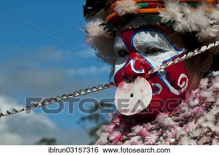 "Member of a tribe in a colourfully decorated costume with face paint at the traditional sing-sing gathering, Hochland, Mount Hagen, Western Highlands Province, Papua New Guinea, Oceania" View Large Photo Image Stock Photograph - "Member of a tribe in a colourfully decorated costume with face paint at the traditional sing-sing gathering, Hochland, Mount Hagen, Western Highlands Province, Papua New Guinea, Oceania". Fotosearch