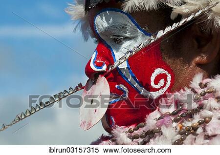 "Member of a tribe in a colourfully decorated costume with face paint at the traditional sing-sing gathering, Hochland, Mount Hagen, Western Highlands Province, Papua New Guinea, Oceania" View Large Photo Image Stock Photography - "Member of a tribe in a colourfully decorated costume with face paint at the traditional sing-sing gathering, Hochland, Mount Hagen, Western Highlands Province, Papua New Guinea, Oceania". Fotosearch