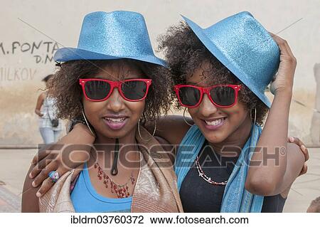 Stock Image - "Members of a carnival club in the slums of Ribeira Bote, Praia, Santiago Island, Cape Verde, Africa". Fotosearch