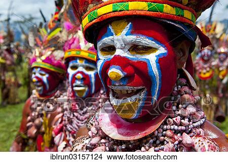Picture - "Members of a tribe in colourfully decorated costumes with face paint at the traditional sing-sing gathering, Hochland, Mount Hagen, Western Highlands Province, Papua New Guinea, Oceania". Fotosearch