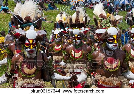 "Members of a tribe in colourfully decorated costumes with face paint at the traditional sing-sing gathering, Hochland, Mount Hagen, Western Highlands Province, Papua New Guinea, Oceania" View Large Photo Image Picture - "Members of a tribe in colourfully decorated costumes with face paint at the traditional sing-sing gathering, Hochland, Mount Hagen, Western Highlands Province, Papua New Guinea, Oceania". Fotosearch