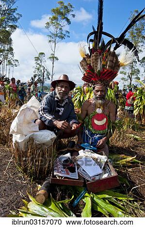 Stock Image - "Members of a tribe in colourfully decorated costumes at the traditional sing-sing gathering, Hochland, Mount Hagen, Western Highlands Province, Papua New Guinea, Oceania". Fotosearch