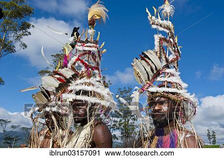 "Members of a tribe in colourfully decorated costumes with face paint at the traditional sing-sing gathering, Hochland, Mount Hagen, Western Highlands Province, Papua New Guinea, Oceania" View Large Photo Image Stock Image - "Members of a tribe in colourfully decorated costumes with face paint at the traditional sing-sing gathering, Hochland, Mount Hagen, Western Highlands Province, Papua New Guinea, Oceania". Fotosearch