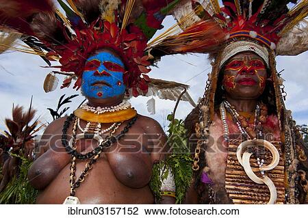 "Members of a tribe in colourfully decorated costumes with face paint at the traditional sing-sing gathering, Hochland, Mount Hagen, Western Highlands Province, Papua New Guinea, Oceania" View Large Photo Image Stock Image - "Members of a tribe in colourfully decorated costumes with face paint at the traditional sing-sing gathering, Hochland, Mount Hagen, Western Highlands Province, Papua New Guinea, Oceania". Fotosearch