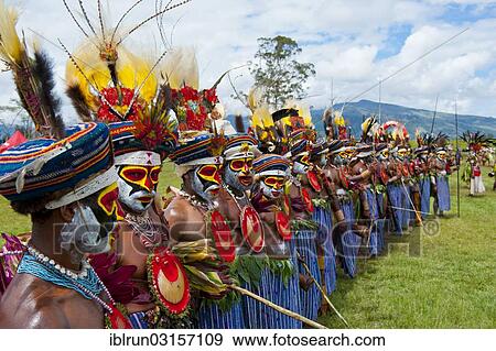 "Members of a tribe in colourfully decorated costumes with face paint at the traditional sing-sing gathering, Hochland, Mount Hagen, Western Highlands Province, Papua New Guinea, Oceania" View Large Photo Image Stock Photo - "Members of a tribe in colourfully decorated costumes with face paint at the traditional sing-sing gathering, Hochland, Mount Hagen, Western Highlands Province, Papua New Guinea, Oceania". Fotosearch