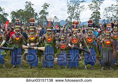 "Members of a tribe in colourfully decorated costumes with face paint at the traditional sing-sing gathering, Hochland, Mount Hagen, Western Highlands Province, Papua New Guinea, Oceania" View Large Photo Image Stock Photo - "Members of a tribe in colourfully decorated costumes with face paint at the traditional sing-sing gathering, Hochland, Mount Hagen, Western Highlands Province, Papua New Guinea, Oceania". Fotosearch