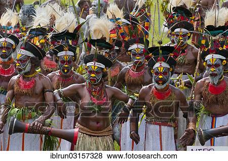 "Members of a tribe in colourfully decorated costumes with face paint at the traditional sing-sing gathering, Hochland, Mount Hagen, Western Highlands Province, Papua New Guinea, Oceania" View Large Photo Image Stock Photo - "Members of a tribe in colourfully decorated costumes with face paint at the traditional sing-sing gathering, Hochland, Mount Hagen, Western Highlands Province, Papua New Guinea, Oceania". Fotosearch