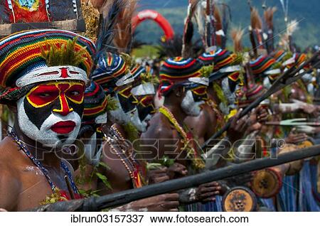 "Members of a tribe in colourfully decorated costumes with face paint at the traditional sing-sing gathering, Hochland, Mount Hagen, Western Highlands Province, Papua New Guinea, Oceania" View Large Photo Image Stock Photo - "Members of a tribe in colourfully decorated costumes with face paint at the traditional sing-sing gathering, Hochland, Mount Hagen, Western Highlands Province, Papua New Guinea, Oceania". Fotosearch