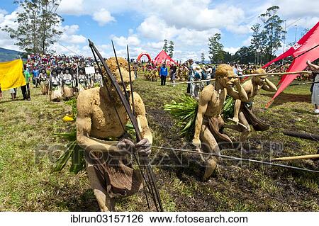 "Members of a tribe in colourfully decorated costumes with face and body paint at the traditional sing-sing gathering, Hochland, Mount Hagen, Western Highlands Province, Papua New Guinea, Oceania" View Large Photo Image Stock Photograph - "Members of a tribe in colourfully decorated costumes with face and body paint at the traditional sing-sing gathering, Hochland, Mount Hagen, Western Highlands Province, Papua New Guinea, Oceania". Fotosearch