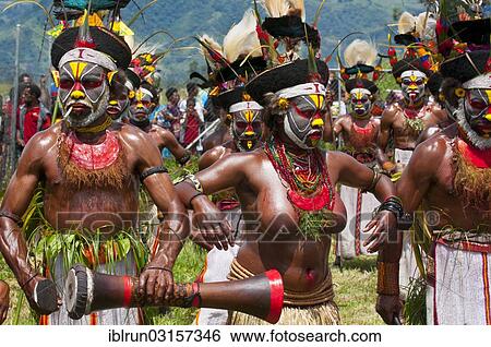 Stock Photograph - "Members of a tribe in colourfully decorated costumes with face paint at the traditional sing-sing gathering, Hochland, Mount Hagen, Western Highlands Province, Papua New Guinea, Oceania". Fotosearch