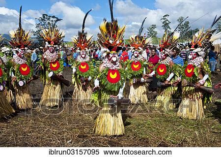 Stock Photography - "Members of a tribe in colourfully decorated costumes with face paint at the traditional sing-sing gathering, Hochland, Mount Hagen, Western Highlands Province, Papua New Guinea, Oceania". Fotosearch