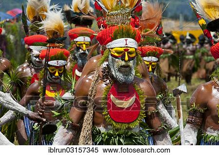 Stock Photography - "Members of a tribe in colourfully decorated costumes with face paint at the traditional sing-sing gathering, Hochland, Mount Hagen, Western Highlands Province, Papua New Guinea, Oceania". Fotosearch