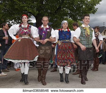 Stock Photograph - "Men and women wearing traditional costumes from the Gailtal valley dancing, Tanz unter der Linde dance, Kufenstechen festival, Feistritz an der Gail, Villach-Land District, Carinthia, Austria, Europe". Fotosearch