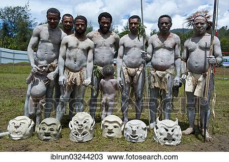 "Men from the tribe of the Mudmen during the traditional Sing Sing in the highlands, Enga, Highlands, Papua New Guinea, Oceania" View Large Photo Image Stock Image - "Men from the tribe of the Mudmen during the traditional Sing Sing in the highlands, Enga, Highlands, Papua New Guinea, Oceania". Fotosearch