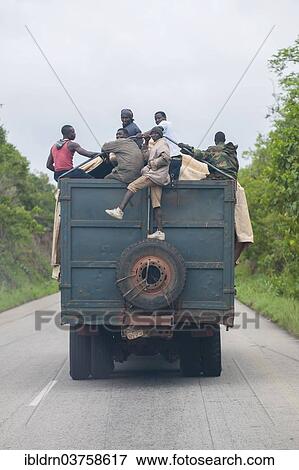 "Men getting a lift on a lorry, Freetown, Western Area, Sierra Leone, Africa" View Large Photo Image Stock Photo - "Men getting a lift on a lorry, Freetown, Western Area, Sierra Leone, Africa". Fotosearch