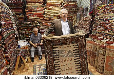"Men in a carpet dealer's store, Kemeralti, Izmir, Izmir Province, Aegean Region, Turkey, Asia" View Large Photo Image Stock Photo - "Men in a carpet dealer's store, Kemeralti, Izmir, Izmir Province, Aegean Region, Turkey, Asia". Fotosearch