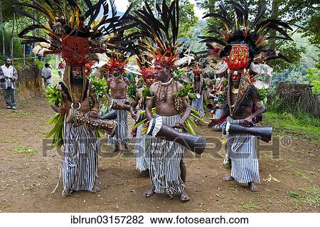 "Men in colourful decorations and face paint are celebrating at the traditional Sing Sing gathering in the highlands, Paya, Papua New Guinea, Oceania" View Large Photo Image Stock Image - "Men in colourful decorations and face paint are celebrating at the traditional Sing Sing gathering in the highlands, Paya, Papua New Guinea, Oceania". Fotosearch