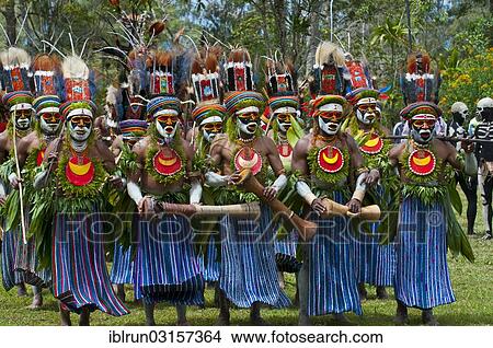 "Men in colourfully decorated costumes with face paint are celebrating at the traditional Sing Sing gathering in the highlands, Paya, Papua New Guinea, Oceania" View Large Photo Image Picture - "Men in colourfully decorated costumes with face paint are celebrating at the traditional Sing Sing gathering in the highlands, Paya, Papua New Guinea, Oceania". Fotosearch