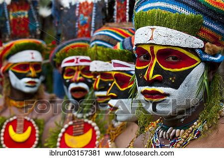 "Men in colourfully decorated costumes with face paint celebrating at the traditional Sing Sing gathering in the highlands, Paya, Papua New Guinea, Oceania" View Large Photo Image Stock Image - "Men in colourfully decorated costumes with face paint celebrating at the traditional Sing Sing gathering in the highlands, Paya, Papua New Guinea, Oceania". Fotosearch