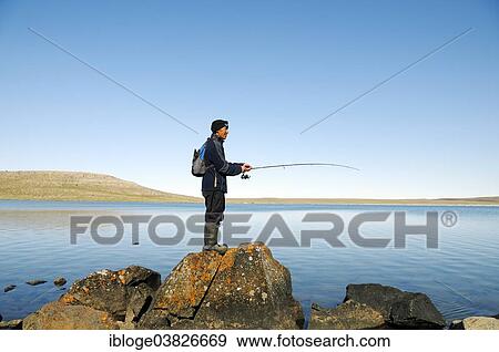 "Men of the Inuit people fishing in a lake, Victoria Island, formerly Holman Island, village of Ulukhaktok, Northwest Territories, Canada, North America" View Large Photo Image Stock Photo - "Men of the Inuit people fishing in a lake, Victoria Island, formerly Holman Island, village of Ulukhaktok, Northwest Territories, Canada, North America". Fotosearch