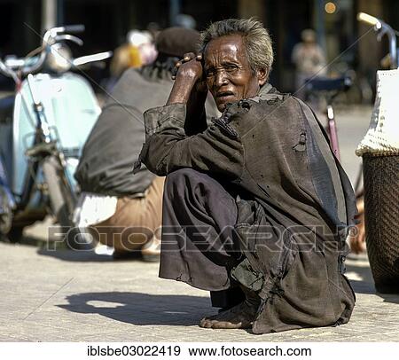 "Men of the people of Cham or Tscham people squatting ont he ground, Da Lat, Provinz Lam Dong, Vietnam, Asia" View Large Photo Image Stock Photo - "Men of the people of Cham or Tscham people squatting ont he ground, Da Lat, Provinz Lam Dong, Vietnam, Asia". Fotosearch