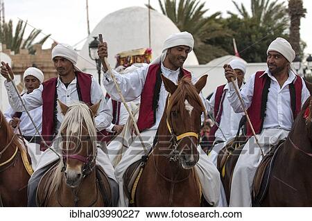 "Men on horseback, horses, Fantasia, Midoun, Djerba, Tunisia, Africa" View Large Photo Image Stock Photo - "Men on horseback, horses, Fantasia, Midoun, Djerba, Tunisia, Africa". Fotosearch