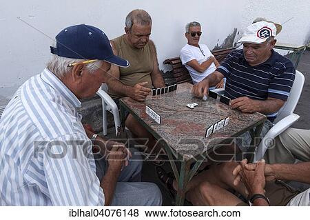"Men playing dominoes, Vueltas, Valle Gran Rey, La Gomera, Canary Islands, Spain, Europe" View Large Photo Image Stock Photo - "Men playing dominoes, Vueltas, Valle Gran Rey, La Gomera, Canary Islands, Spain, Europe". Fotosearch