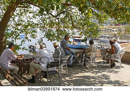 "Men relaxing at the fishing port, Hisar, Black Sea, Bartin Province, Black Sea Region, Turkey, Asia" View Large Photo Image Picture - "Men relaxing at the fishing port, Hisar, Black Sea, Bartin Province, Black Sea Region, Turkey, Asia". Fotosearch