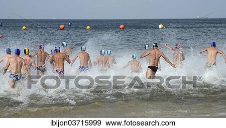 "Men running into the sea, Swinoujscie, Usedom, West Pomeranian Voivodeship, Poland, Europe" View Large Photo Image Stock Photo - "Men running into the sea, Swinoujscie, Usedom, West Pomeranian Voivodeship, Poland, Europe". Fotosearch