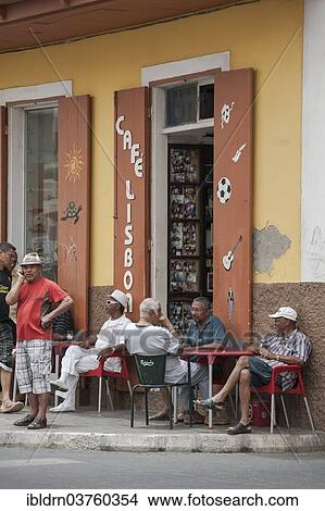 "Men sitting in the Lisboa Cafe in the historic centre of Mindelo, Sao Vicente, Cape Verde, Africa" View Large Photo Image Picture - "Men sitting in the Lisboa Cafe in the historic centre of Mindelo, Sao Vicente, Cape Verde, Africa". Fotosearch