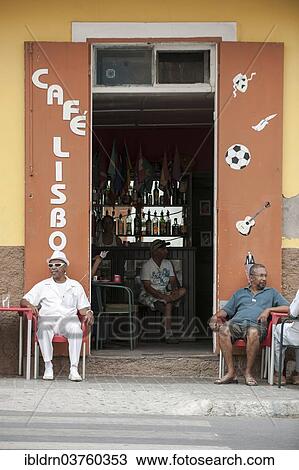 "Men sitting in the Lisboa cafe in the historic centre of Mindelo, Sao Vicente, Cape Verde, Africa" View Large Photo Image Stock Image - "Men sitting in the Lisboa cafe in the historic centre of Mindelo, Sao Vicente, Cape Verde, Africa". Fotosearch