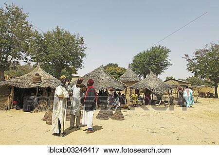 Stock Photo - "Men wearing traditional Muslim clothing at the market, Tourou, Far North, Cameroon, Africa". Fotosearch