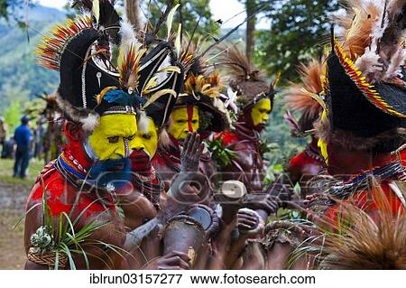 "Men with colourful decorations and face paint are celebrating at the traditional Sing Sing gathering in the highlands, Paya, Papua New Guinea, Oceania" View Large Photo Image Stock Photo - "Men with colourful decorations and face paint are celebrating at the traditional Sing Sing gathering in the highlands, Paya, Papua New Guinea, Oceania". Fotosearch