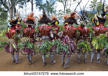 "Men with colourful decorations and face paint are celebrating at the traditional Sing Sing gathering in the highlands, Paya, Papua New Guinea, Oceania" View Large Photo Image Stock Photo - "Men with colourful decorations and face paint are celebrating at the traditional Sing Sing gathering in the highlands, Paya, Papua New Guinea, Oceania". Fotosearch