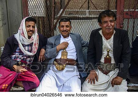 "Men with their djambias sitting in front of a house in the old city, Sana'a, Yemen, Asia" View Large Photo Image Stock Photograph - "Men with their djambias sitting in front of a house in the old city, Sana'a, Yemen, Asia". Fotosearch