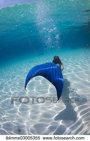 "Mermaid, girl wearing a mermaid costume swimming in the shallow water of a lagoon, underwater, Busuanga, Philippines, Asia" View Large Photo Image Stock Photography - "Mermaid, girl wearing a mermaid costume swimming in the shallow water of a lagoon, underwater, Busuanga, Philippines, Asia". Fotosearch