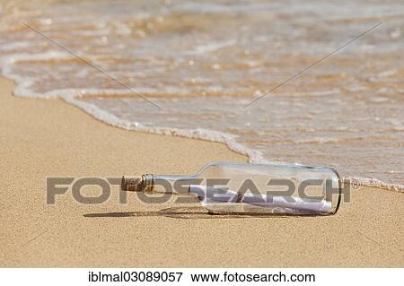 "Message in a bottle lying on the beach, Risco del Paso, Fuerteventura, Canary Islands, Spain, Europe" View Large Photo Image Stock Photo - "Message in a bottle lying on the beach, Risco del Paso, Fuerteventura, Canary Islands, Spain, Europe". Fotosearch