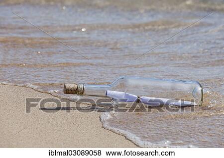 "Message in a bottle lying on the beach, Risco del Paso, Fuerteventura, Canary Islands, Spain, Europe" View Large Photo Image Stock Photo - "Message in a bottle lying on the beach, Risco del Paso, Fuerteventura, Canary Islands, Spain, Europe". Fotosearch
