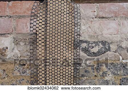 "Metal mesh or lath with insulating paper for a supportive plaster base, wall below windows, renovation of an old building, Stuttgart, Baden-Wuerttemberg, Germany, Europe" View Large Photo Image Stock Image - "Metal mesh or lath with insulating paper for a supportive plaster base, wall below windows, renovation of an old building, Stuttgart, Baden-Wuerttemberg, Germany, Europe". Fotosearch