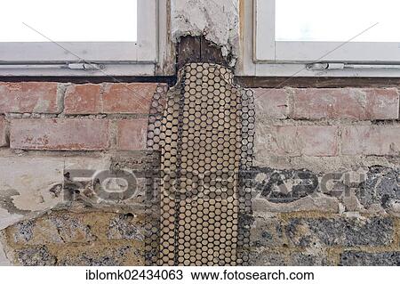 "Metal mesh or lath with insulating paper for a supportive plaster base, wall below windows, renovation of an old building, Stuttgart, Baden-Wuerttemberg, Germany, Europe" View Large Photo Image Stock Image - "Metal mesh or lath with insulating paper for a supportive plaster base, wall below windows, renovation of an old building, Stuttgart, Baden-Wuerttemberg, Germany, Europe". Fotosearch
